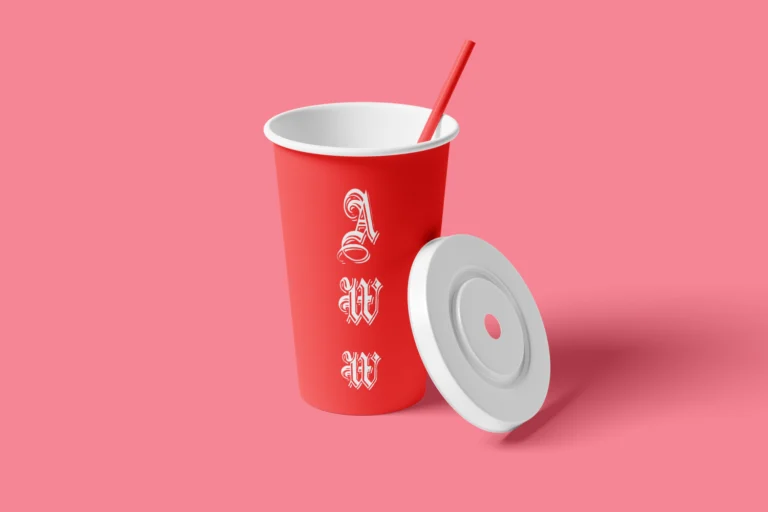 Red paper drink cup with white typography, red straw, and separate white lid on a pink background