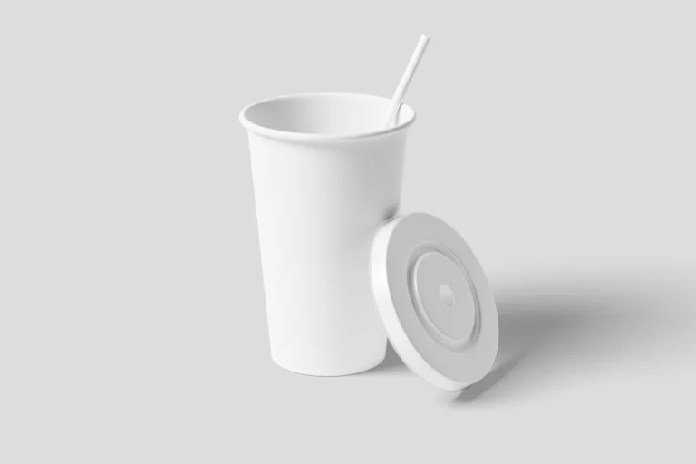 Blank white paper drink cup with a straw and separate white lid on a light gray background