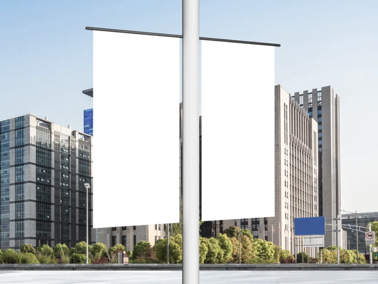 Blank vertical lamp post banners mockup displayed in a modern urban street