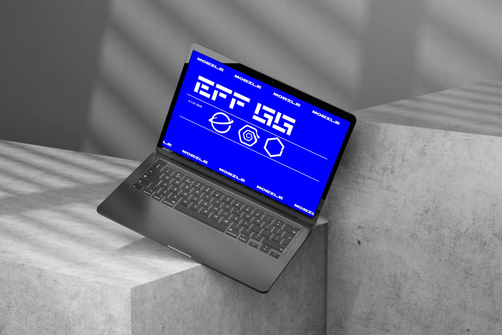Laptop screen mockup with blue interface displayed on concrete blocks